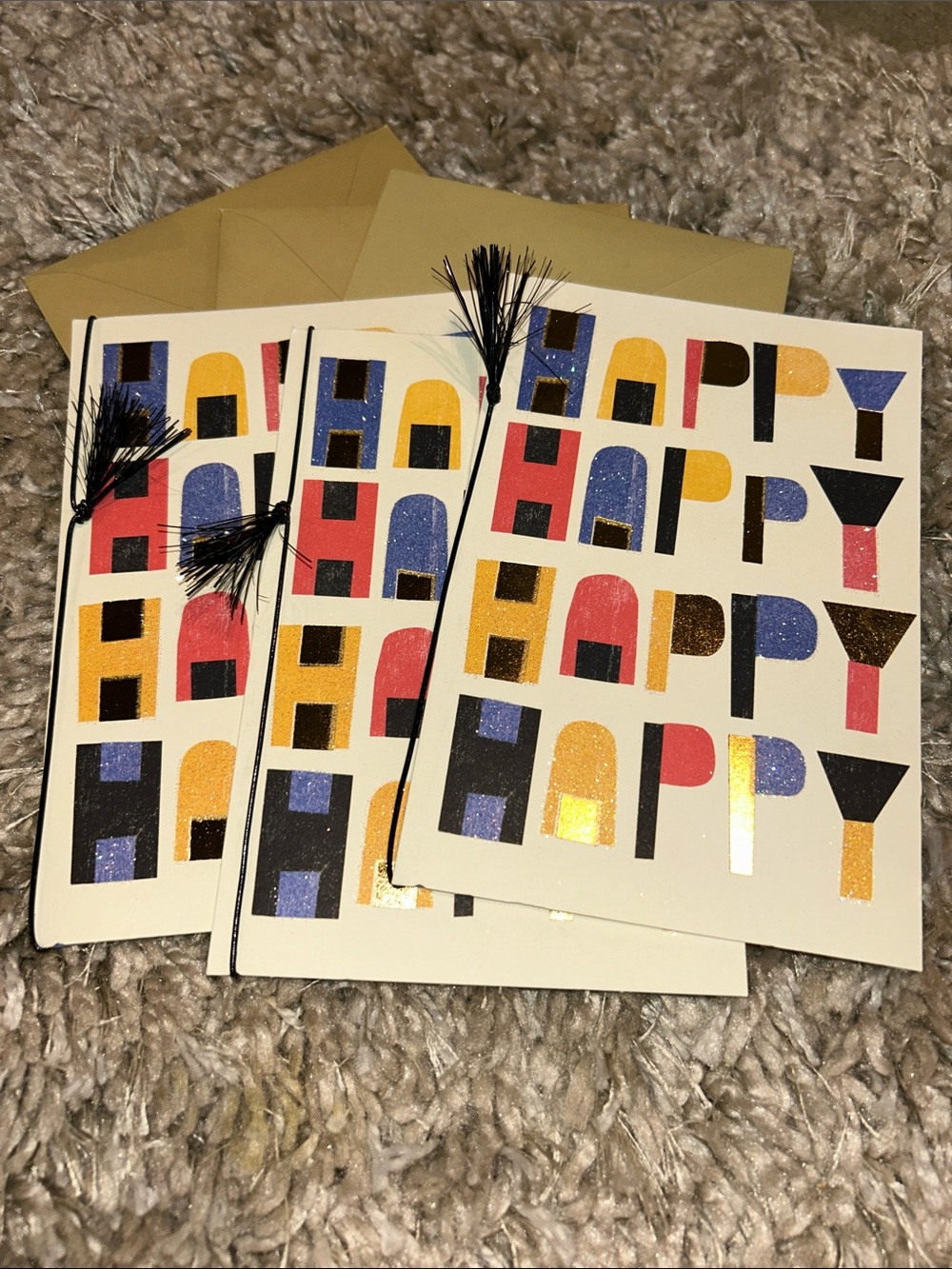 Hallmark Multicolor Foil "HAPPY" Cards with Black Tassels